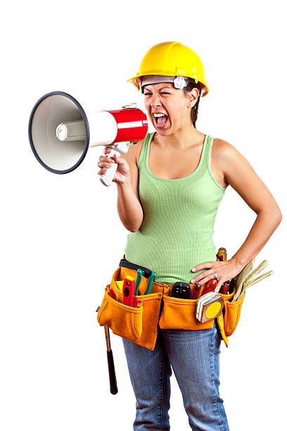 istock female contruction worker screaming in megaphone 182866035