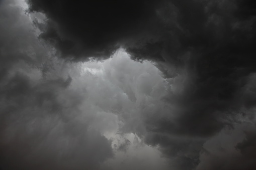 Dark grey storm clouds with limited light