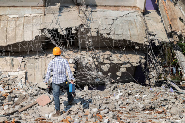 istock Engineer or contractor holding tool box in destruction demolishing building. 1828662915