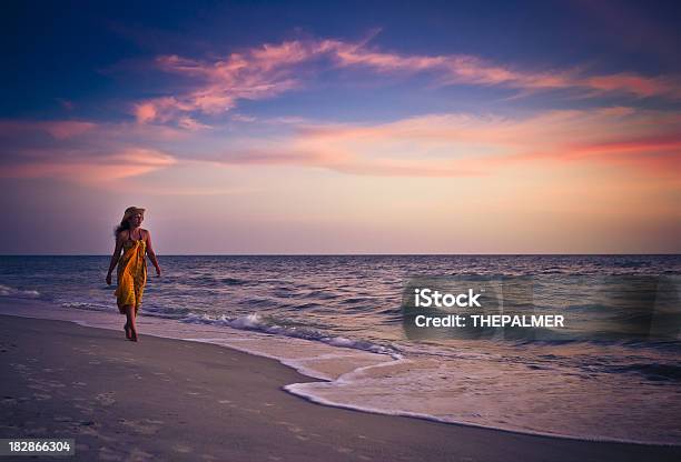 Woman Walking On The Beach Stock Photo - Download Image Now - Adult, Beach, Cloud - Sky