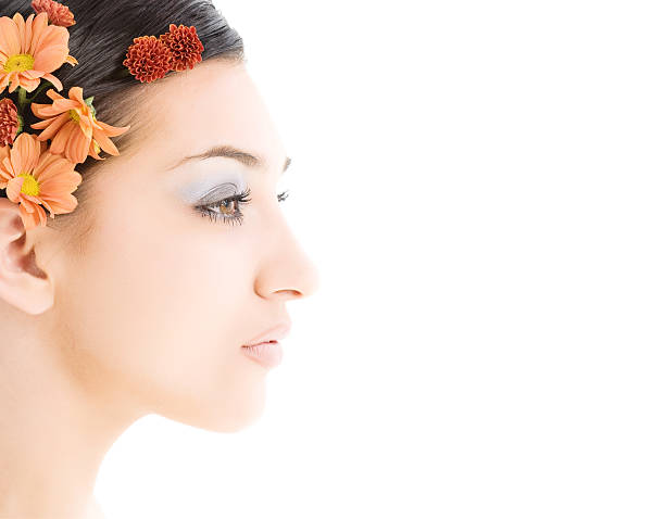 istock Close-up of beautiful face with flowers 182866441