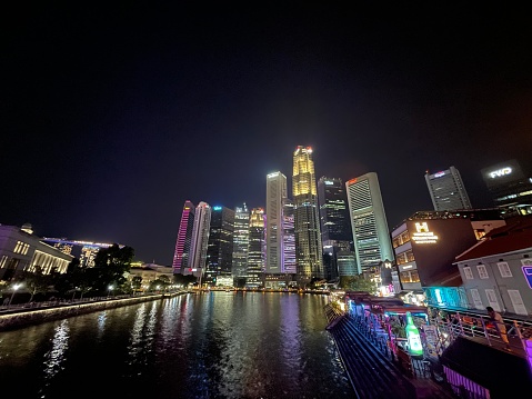 walk among the city line of Singapore at night with all the flashy lights and lively environment.