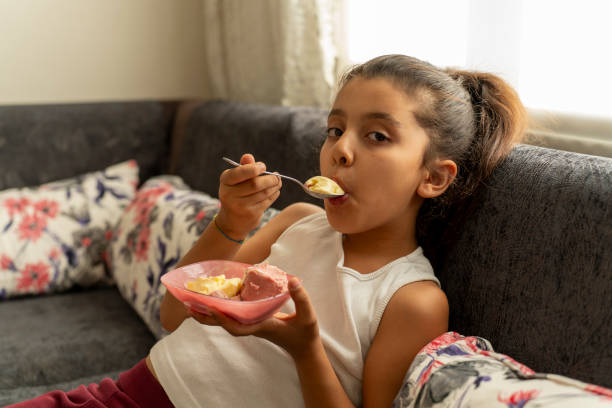 istock A girl eating ice cream. 1828667807