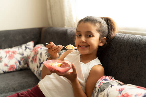 istock A girl eating ice cream. 1828667813