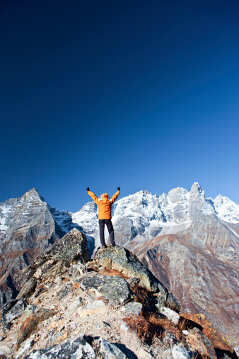 Woman lifts her arms in victory - Mount Everest National Park.http://bem.2be.pl/IS/nepal_380.jpg