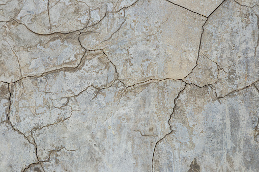 Close-up crack white texture. Concrete cement wall. Industrial building broken. Distressed seamless background. Gray asphalt vintage. Surface stone patterns. Detail ruin destruction. Abstract overlay.