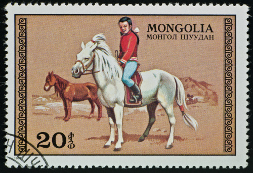 motive stamp with postmark.girl on horse in mongolia. different stamps with different horse breeds and other animals: