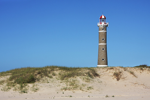 Bright sunny day at the coast. View of the lighthouse of Jose Ignacio, Punta del Este, Uruguay.