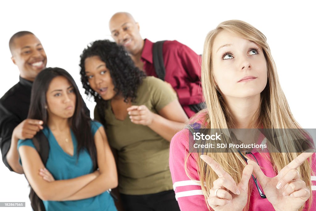 Group of Students Teasing Girl Who Doesn't Care Group of Students Teasing Girl Who Doesn't Care. Girl making 'W' for Whatever.See more from this series: Letter W Stock Photo