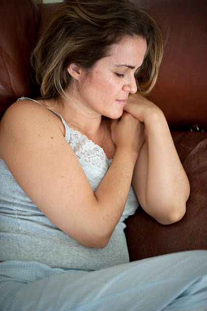 istock Forty something woman sleeping on the couch 182868164