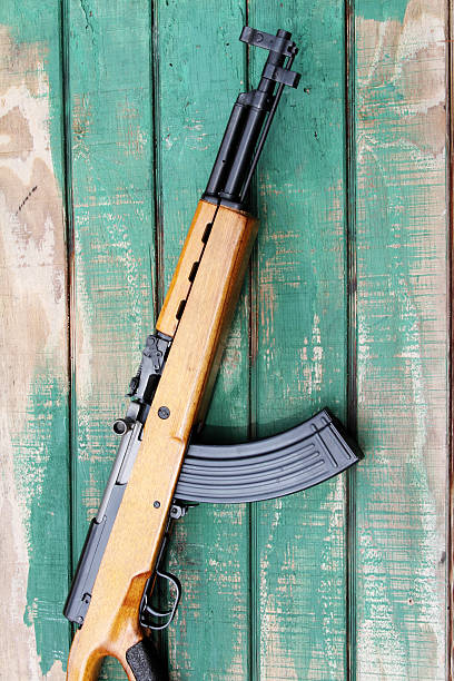 istock Military rifle against wood background. Semi-automatic carbine. 182868229