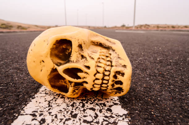 Road Death Concept Skull on the Asphalt Street