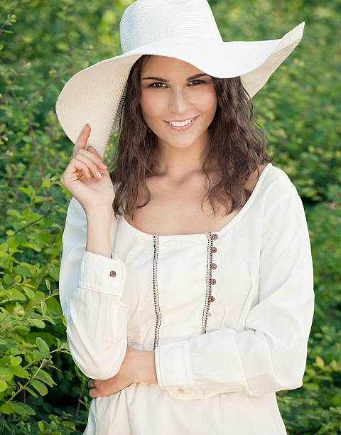 A beautiful farm girl in a traditional summer outfit with a perfect toothy candid smile. Nikon D3X. Converted from RAW. 100% Crop.