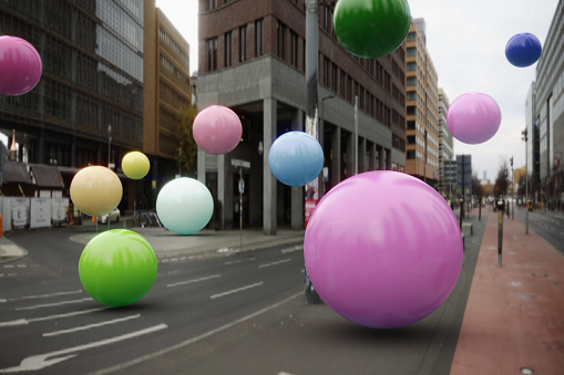 Multi colored balloons flying in the city
