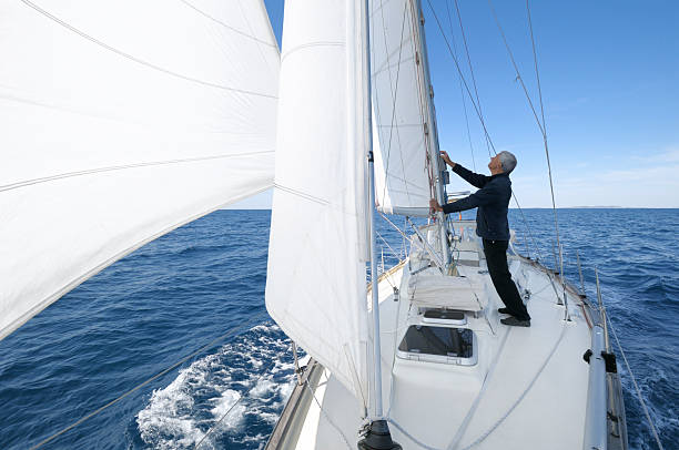 istock Senior man on the sailing boat 182869437