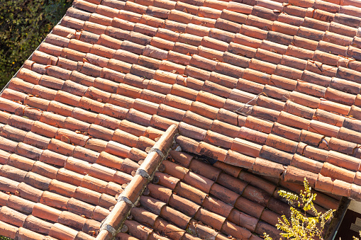 Metal tile on the roof. Roof repairing