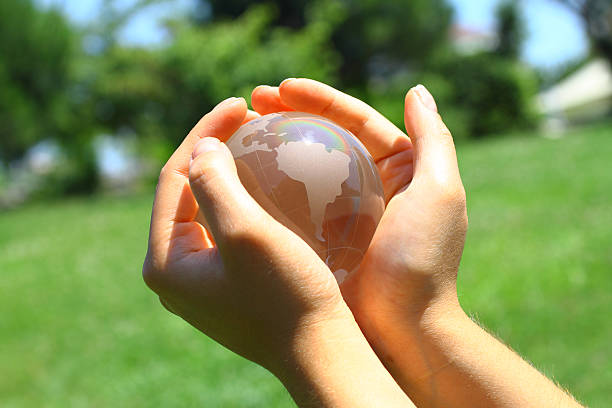 Globe in hand stock photo