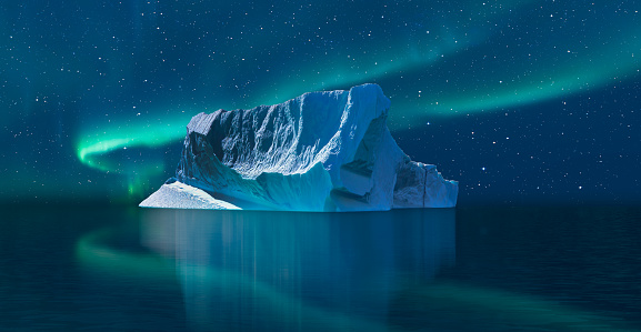 Iceberg floating in greenland fjord  \nwith aurora borealis - Greenland