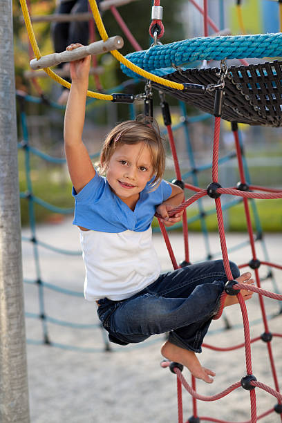 istock girl on playground 182869907