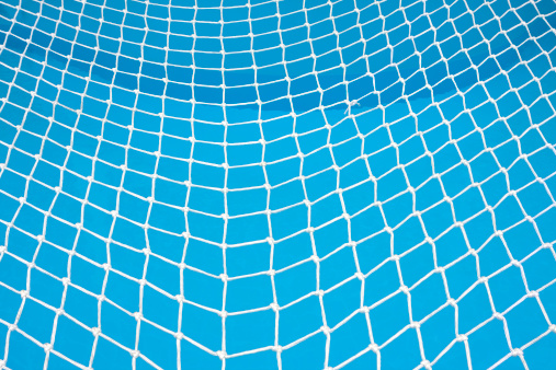 Safety net covering a swimming pool.