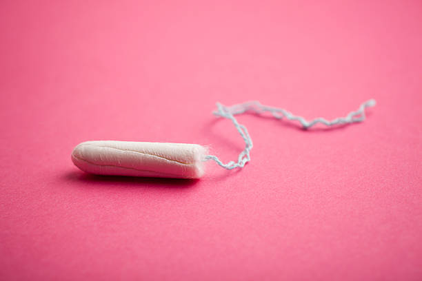 Tampon on pink background stock photo