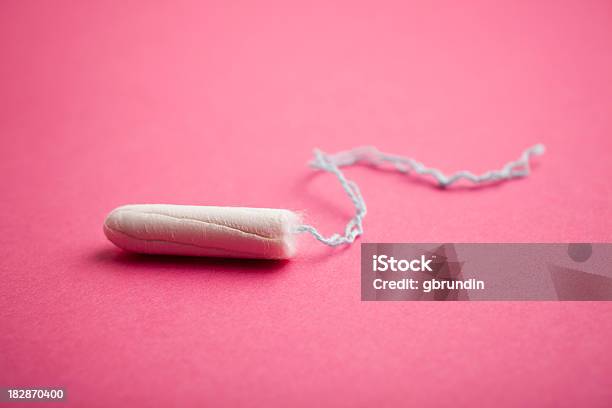 Tampon On Pink Background Stock Photo - Download Image Now - Tampon, Colored Background, Menstruation