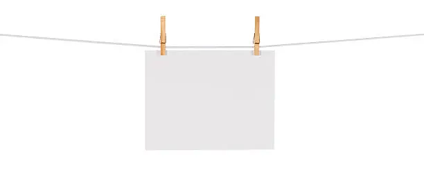 This is a photo of a white card hanging on a clothesline isolated against a white background. Click on the links below to view lightboxes.