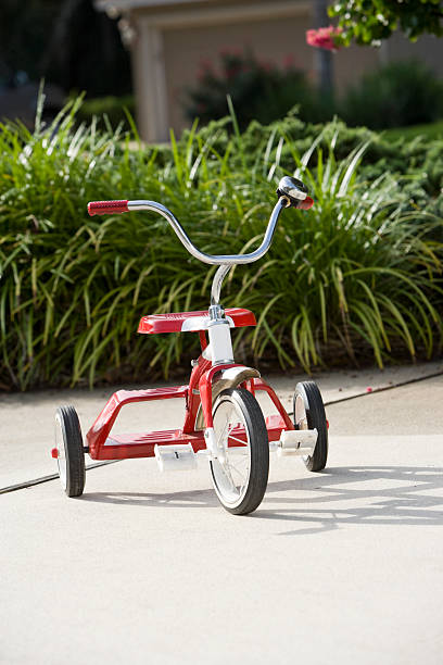 istock Child's tricycle on driveway 182870920