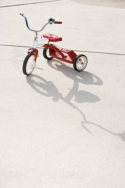 Child's tricycle on driveway