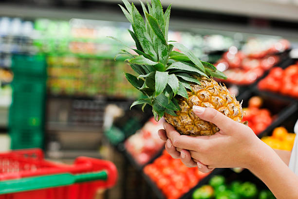 istock Woman Holding Pineapple 182871527