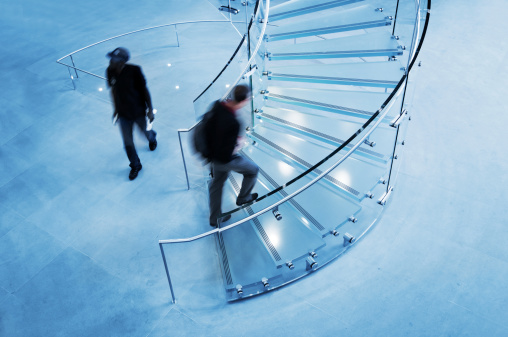 Modern Glass Staircase Silhouette of walking People