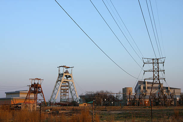 istock Gold mine buildings with head gear and power cables 182871767