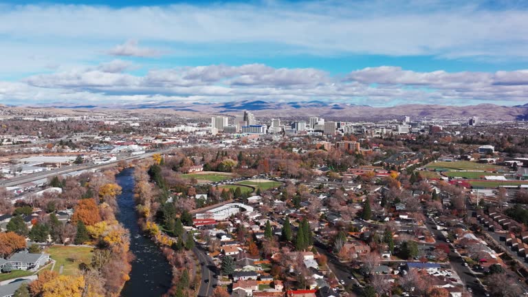 Drone view panning over a river just outside of downtown Reno, Nevada