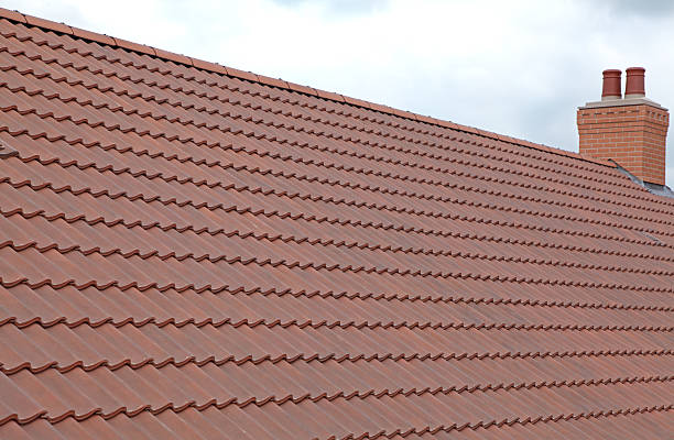 istock new roof and twin chimney pot 182872335
