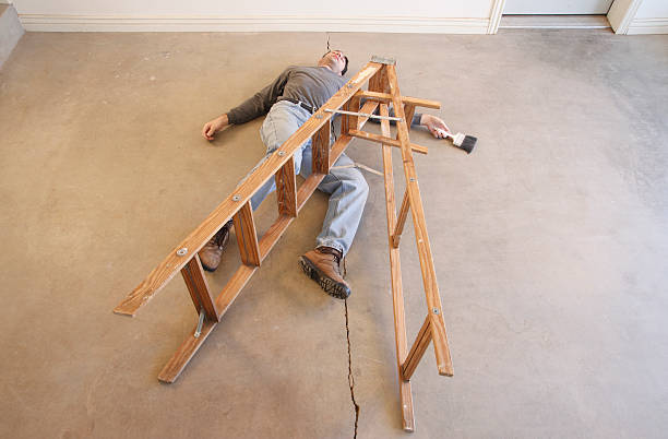 istock Ladder Safety Accident: Man Falls Off Step-Ladder 182872474