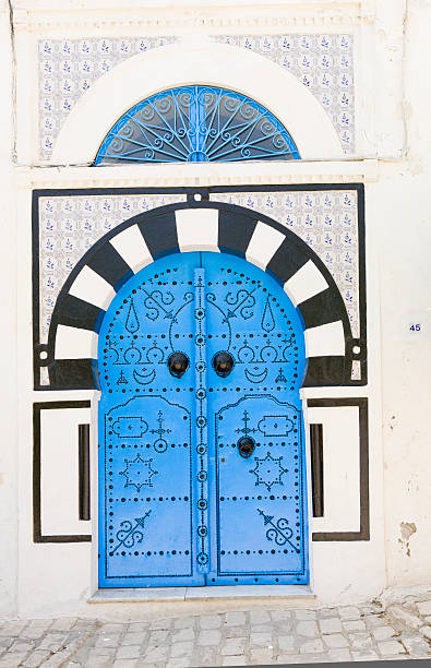 istock Tunisia: Blue, White and Black Arched Doorway 182872485