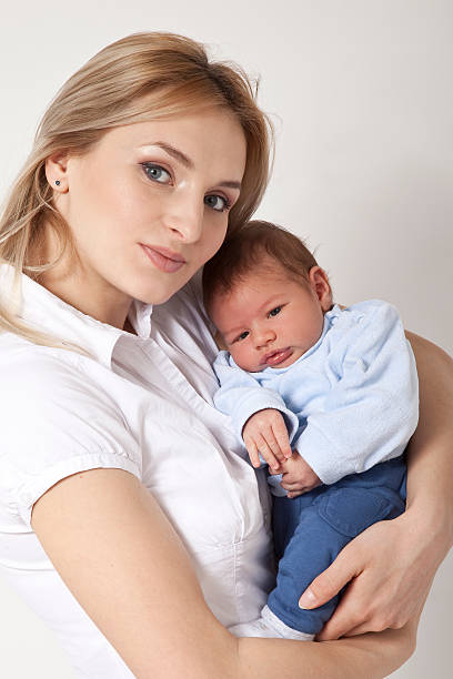 istock Mother holding baby 182872919