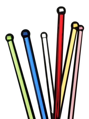 A group of colorful antique swizzle sticks photographed with selective focus.