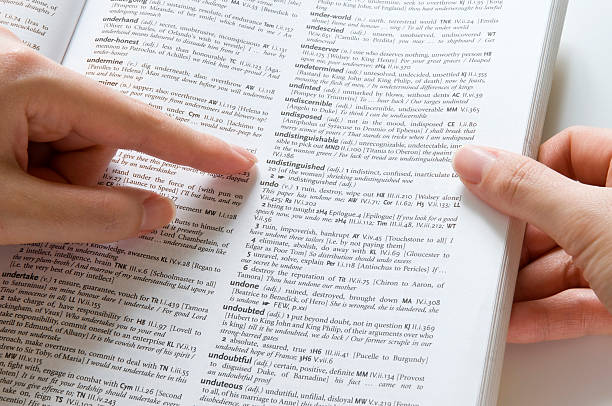 Looking Up a Dictionary stock photo