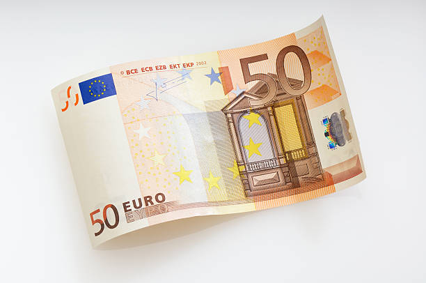 Waved fifty Euro note Bent 50 Euro bill. (XXL-File) european union euro note stock pictures, royalty-free photos & images