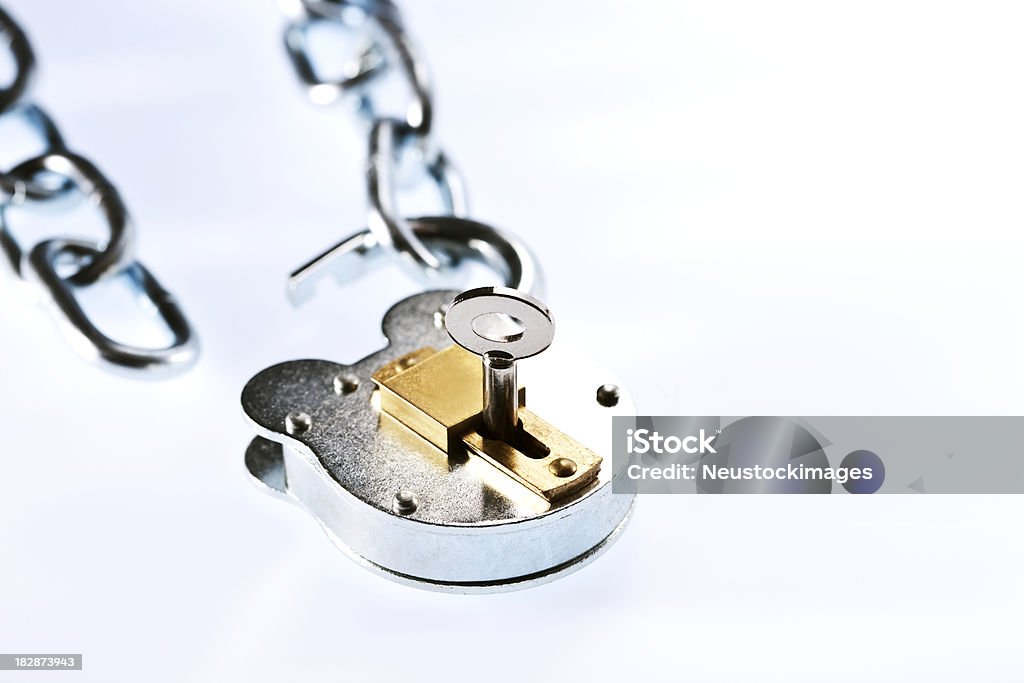Open Lock and Chain Metal padlock and key with two pieces of a chain. Horizontal shot. Chain - Object Stock Photo