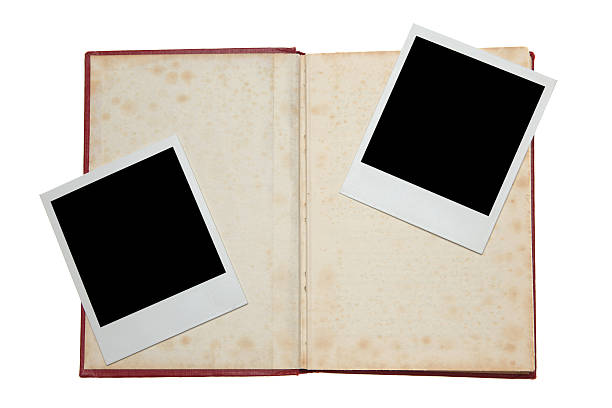 istock Open book with blank polaroid picture 182873994