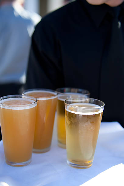 istock Waiter with tray of beer 182874100