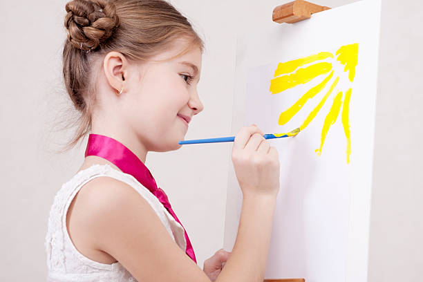 istock Young girl with easel 182874439