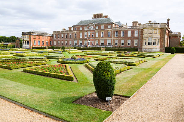 Wimpol Hall & Formal Garden "Wimpole Hall Stately Home, in  Cambridgeshire, England, standing in a fine formal, parterre garden, designed by feted landscape gardeners, Capability Brown and Humphry Repton. The house, originally built in in 1643, sits in 2500 acres of woodland estate.." knot garden stock pictures, royalty-free photos & images