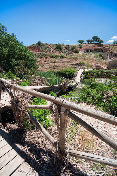 istock Flood damaged bridge across a river 182874823