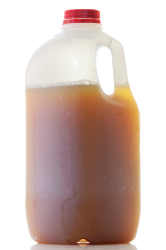 A single plastic jug of Apple Cider isolated on white.