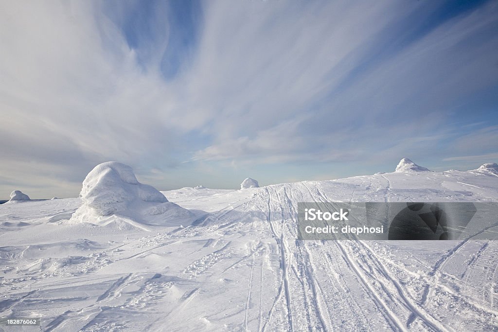 pure nature ski tracks on fresh snow on the mountain top Barren Stock Photo