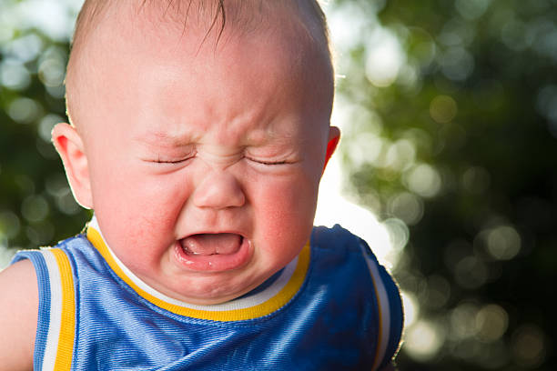 Crying Baby Boy Little baby boy crying hard rosy cheeks stock pictures, royalty-free photos & images