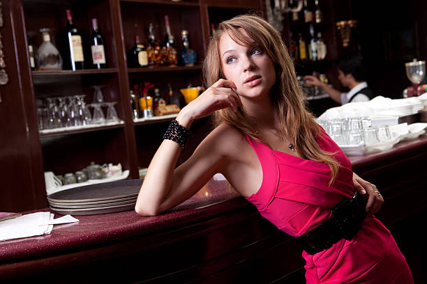 istock beautiful woman in the bar 182876801